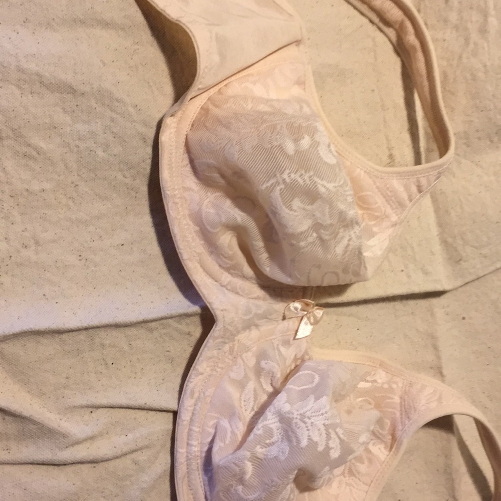 2 Breezies underwire bras in soft, light pink.